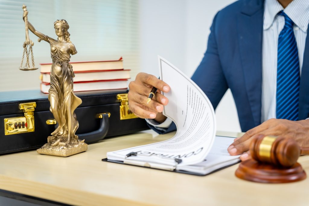 Male Asian lawyer in formal suit handles contracts, agreements, legal obligations, rights liberties